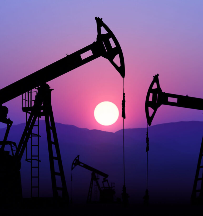 oil well plant against sunset